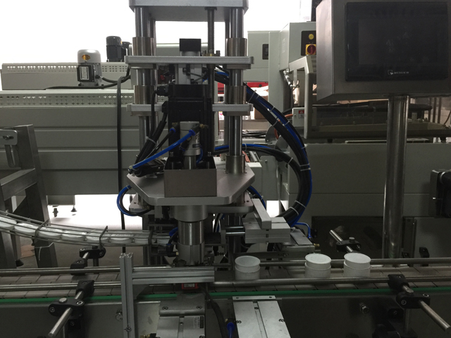 makinë vulosje e kavanozëve.jpg