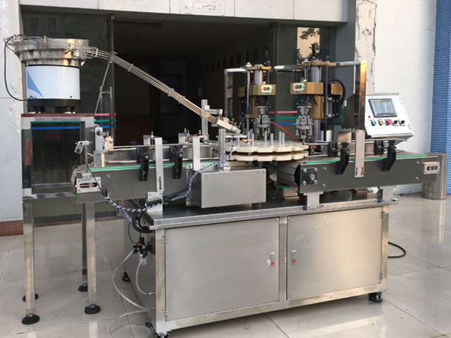 capping machine with 2 capping heads pajisja me kapak me vida gjysmë automatike.jpg