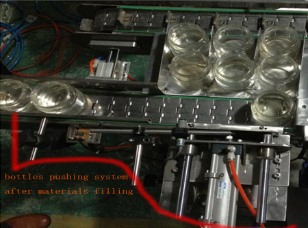 automatic bottles pushing system after filing sistemi i shtyrjes së shisheve.jpg